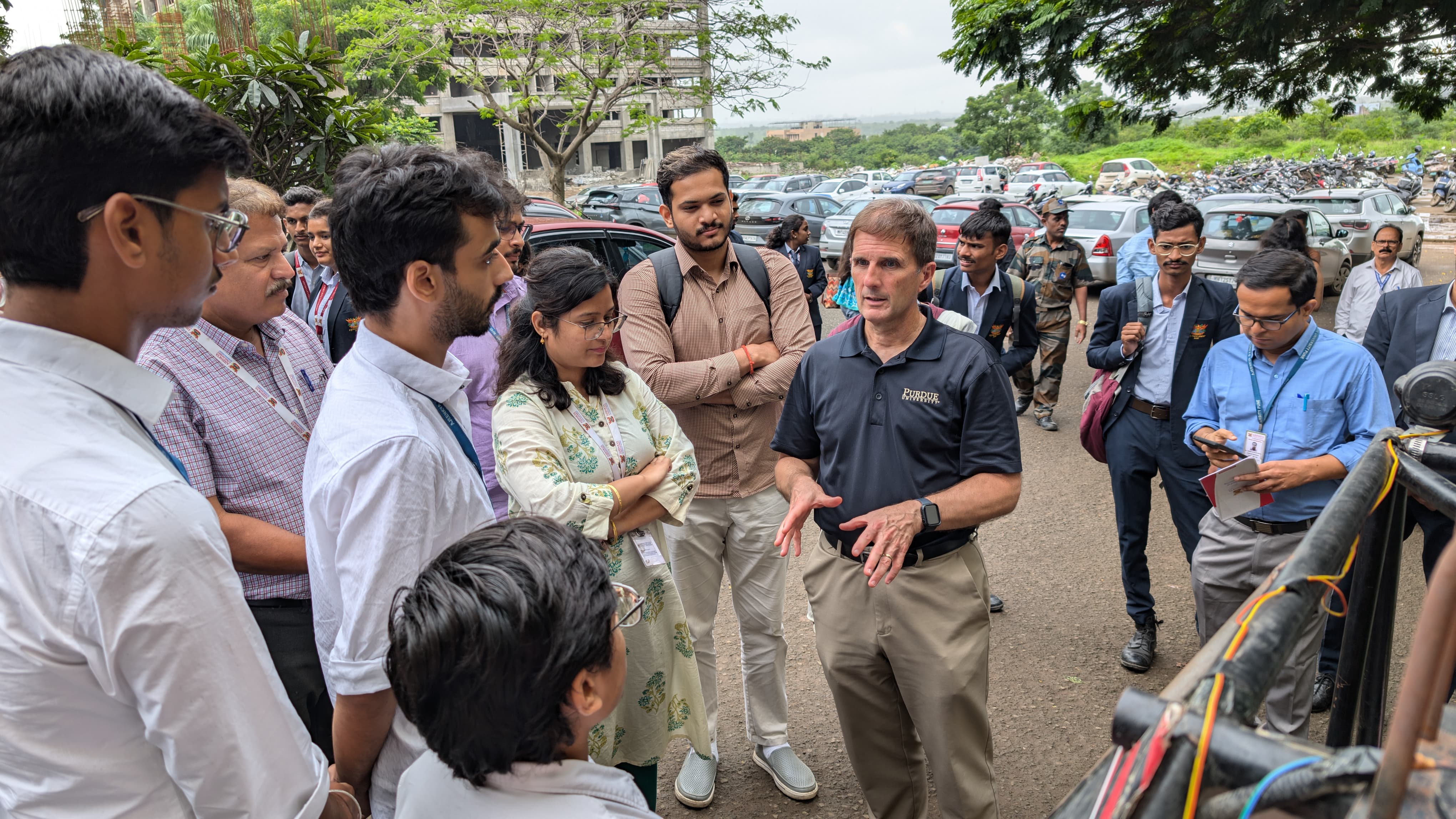 Team Avinya explaining electric ATV features to foreign delegates at SAEINDIA eBAJA competition